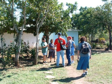 Inviting locals to the outdoor clinic set up in village